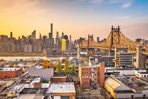 Aerial view of Queens showcasing urban landscape and neighborhoods, highlighting security guard services in NYC