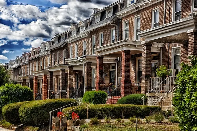 Row of brick townhouses with front porches, highlighting the need for residential security guard services