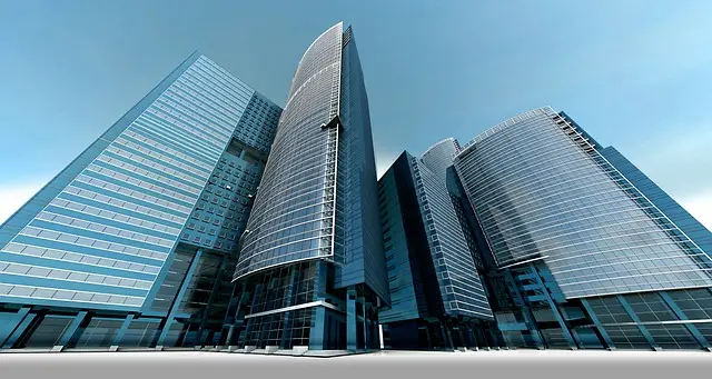 Aerial view of modern skyscrapers against a clear blue sky, representing commercial building security services